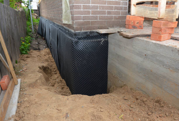 Happy homeowners after waterproofing job in Stafford